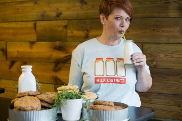 Pictured, Trina Gregory-Propst of Se7en Bites Bakery in a new Bungalower Milk District shirt. Photo by Liv Jonse