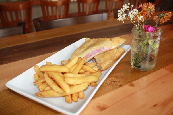 Ham and Cheese Turnover: Puff Pastry stuffed with Ham and Swiss, fried to a golden brown and served with Fries