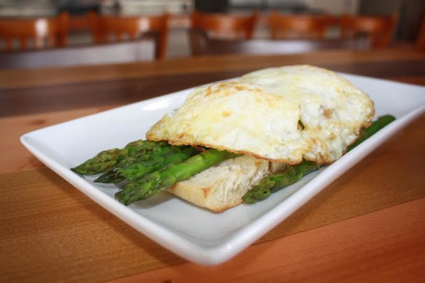 Truffled Eggs: Two Fried Eggs, oven-toasted Ciabatta Bread with Asparagus, crispy Pancetta and Truffle Oil