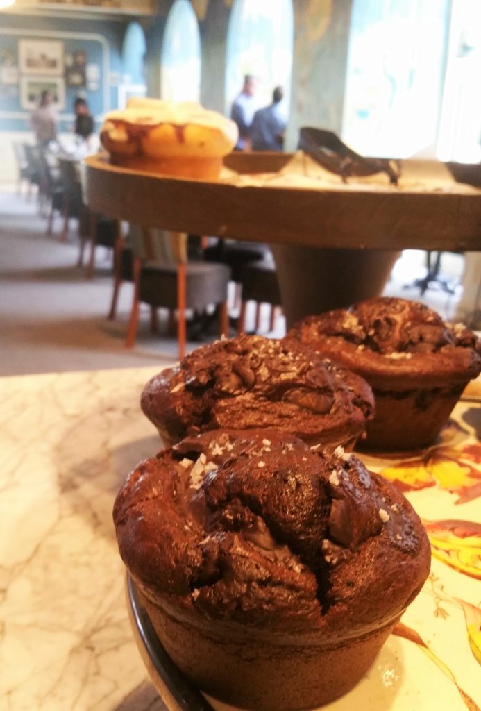 Pastry counter offerings -pictured; chocolate muffins with salt grains and cinnamon buns 