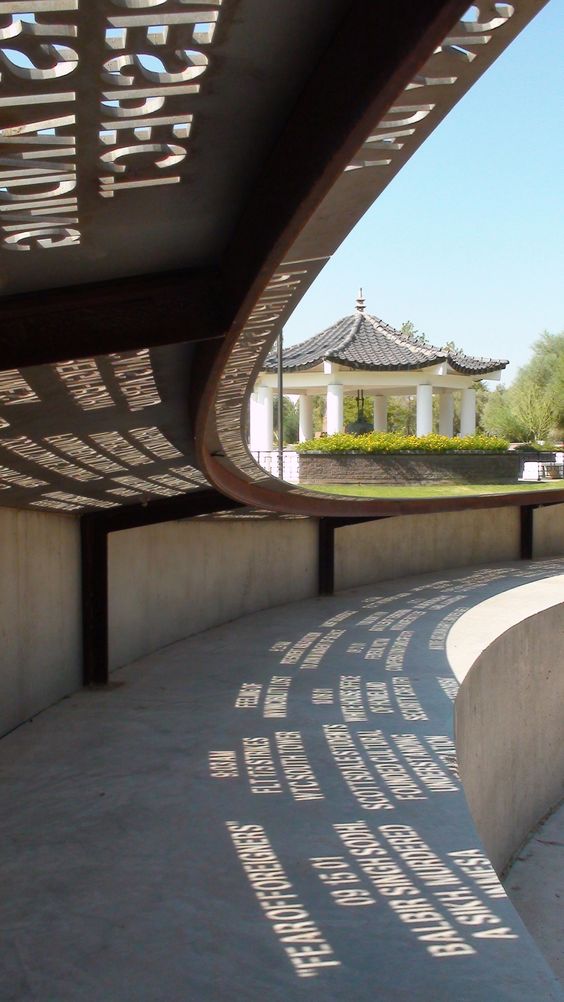 Sunlight shines through laser-cut phrases at the Moving Memories Memorial in Phoenix. The phrases are meant to reflect a range of thoughts from Arizonans affected by 9/11, and were picked after months of research.